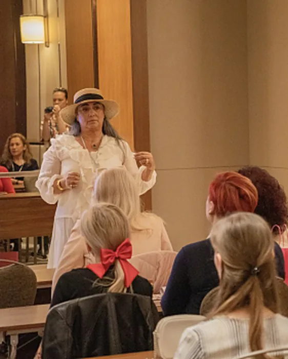 Liora Caspi speaking to women at a Liora event