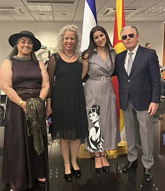Liora Caspi with partners at an embassy reception